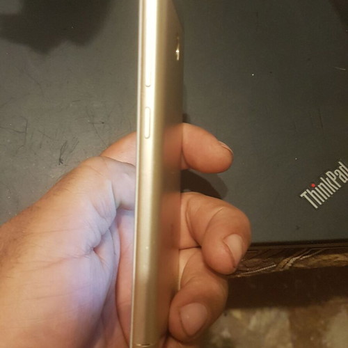 Xiaomi Redmi 4X smartphone with cracked screen, gold