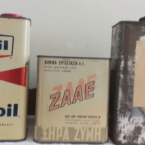 Old metal containers set with Mobil, ZAAE and Petrolatum Liquid