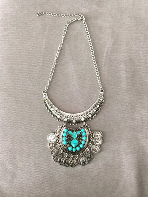 Steel necklace like new, missing one turquoise stone