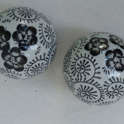Vintage decorative porcelain spheres set like new with floral and geometric designs