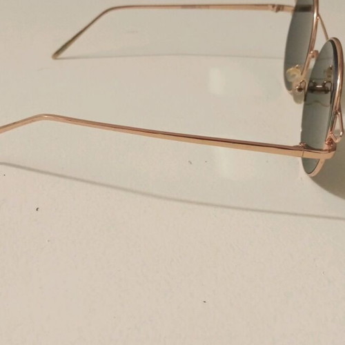 Sunglasses like new with rose gold frame and color-changing lenses