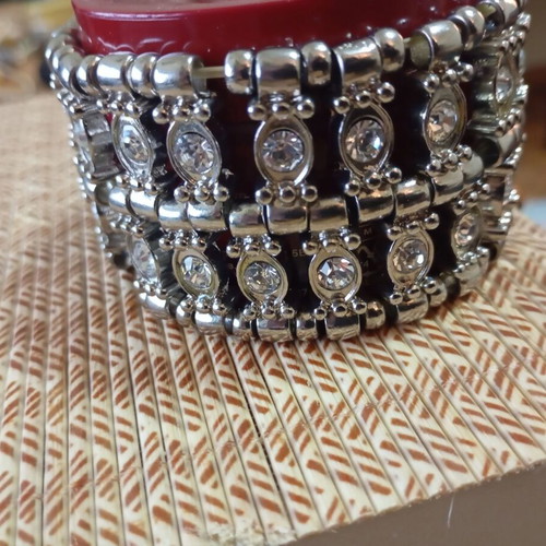 Large bracelet with rhinestones silver like new, elastic band