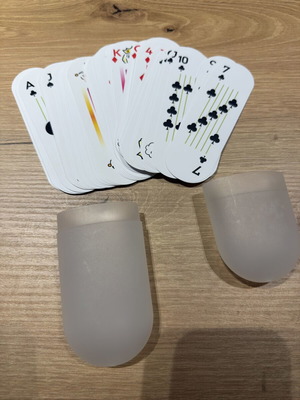 Pill shaped playing cards deck with travel case