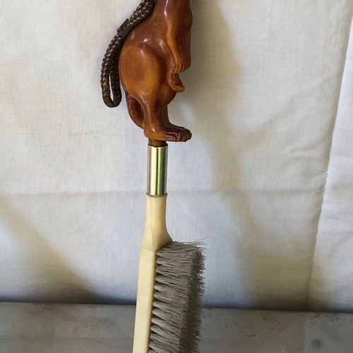 Shoe brush and shoehorn set used with kangaroo sculpture