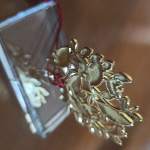 Decorative gouri with glass base and red leaves
