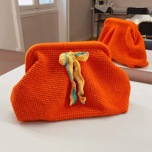 Handmade knitted clutch bag orange with metal frame