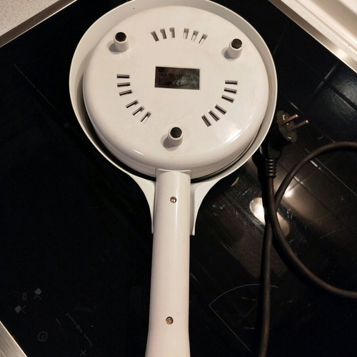 Electric handheld crepe maker like new with non-stick surface