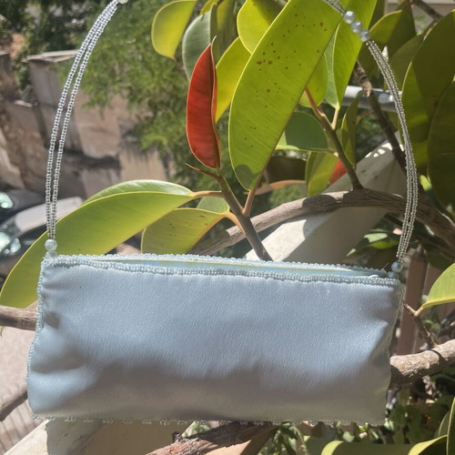 Light blue satin handbag with beads