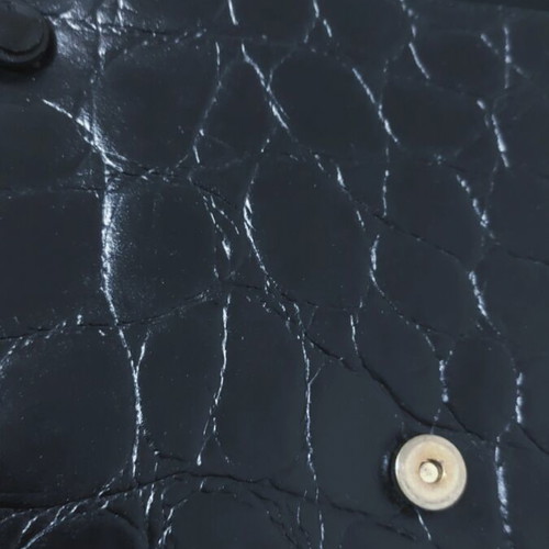 Vintage black leather handbag with crocodile texture and gold details