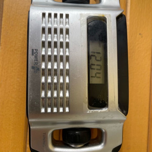 Power Plus solar transistor radio used with clock and flashlight