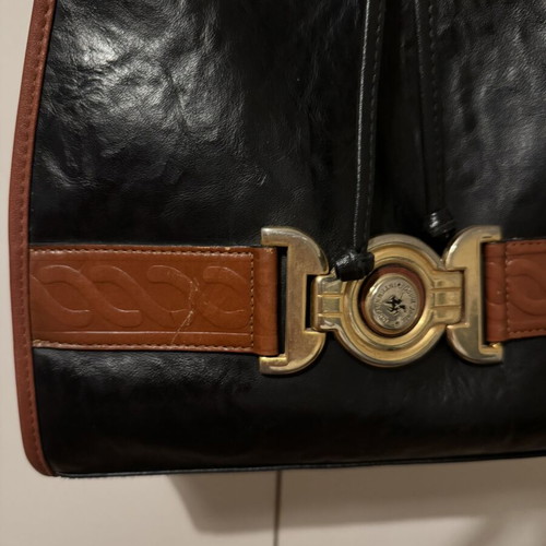 Bartuggi vintage leather shoulder bag black with brown details and gold buckle like new