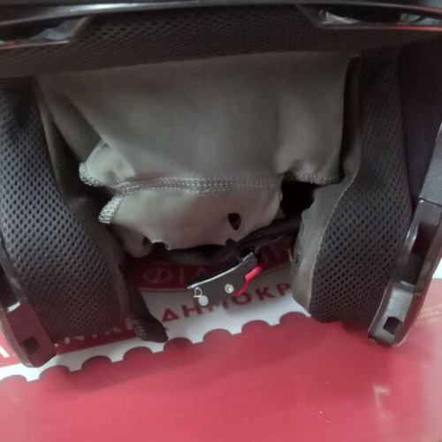 Nolan helmet used, flip-up with tinted visor and side communication