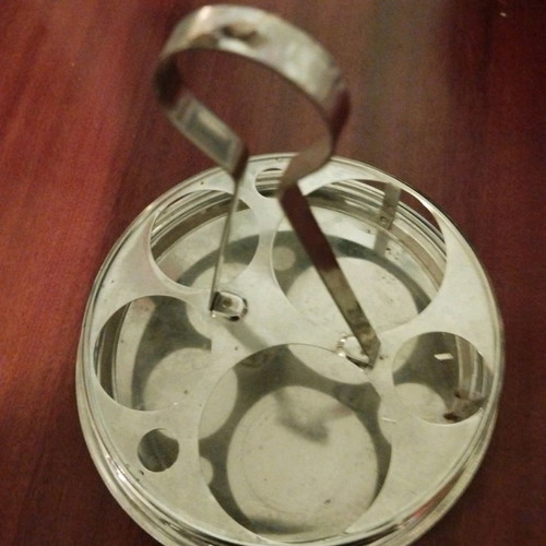 Metal cafe-style coaster used, for small glasses