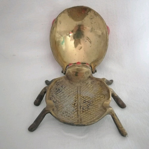 Bronze ashtray used with red scarab-shaped stones