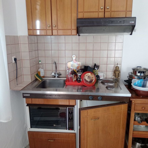 Kitchen unit used with oven, fridge, sink, and extractor fan