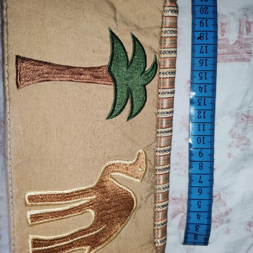 Ethnic fabric bag with embroidered camel and palm tree design