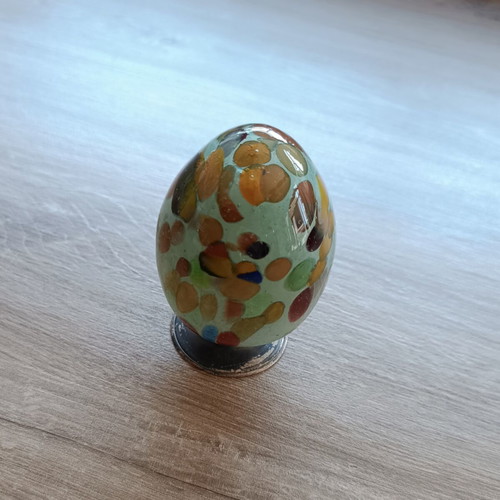 Handmade glass egg with silver base like new