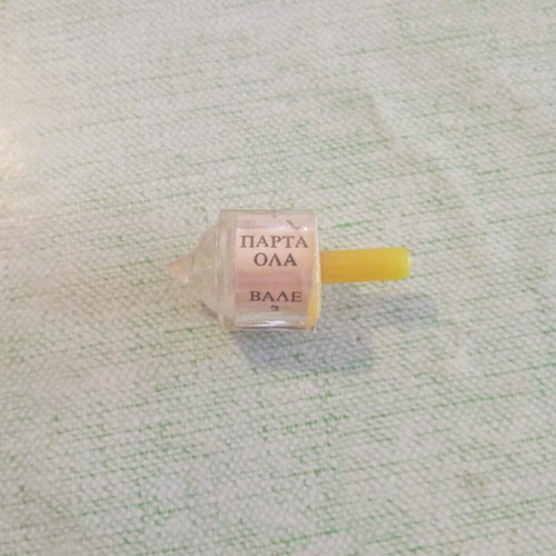 «Parta Ola» classic spinning top used for traditional luck game