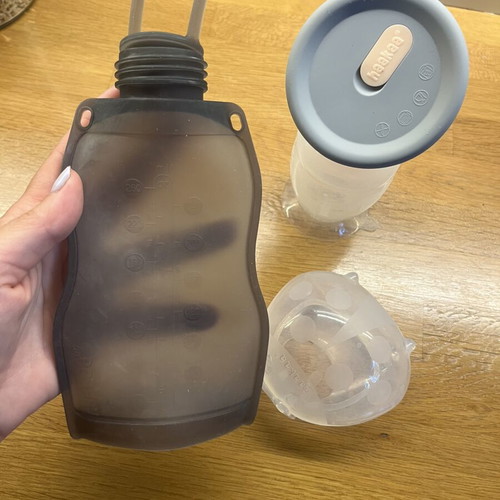 Haakaa breast pump set like new with milk storage bag