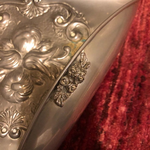 Decorative triangular vessel used with embossed flowers