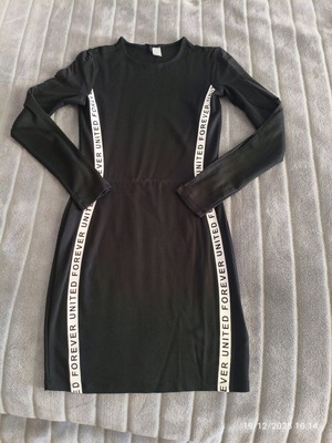Black fitted dress with transparent sleeve, size M, like new
