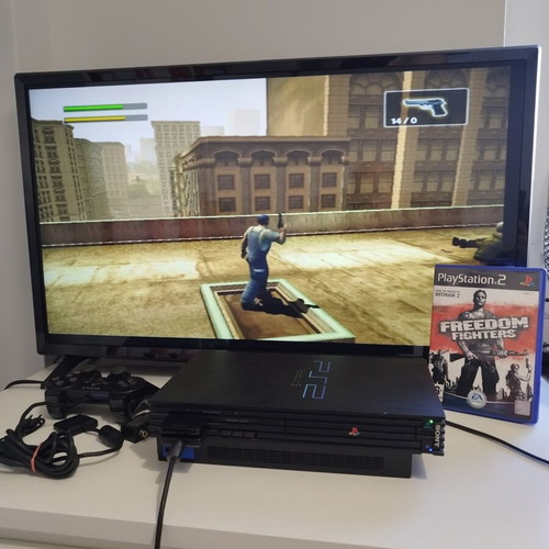PlayStation 2 Fat console used with 2 controllers, memory card and 21 games