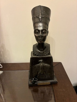 Decorative brass item used, dated 1955-1970 with wooden base