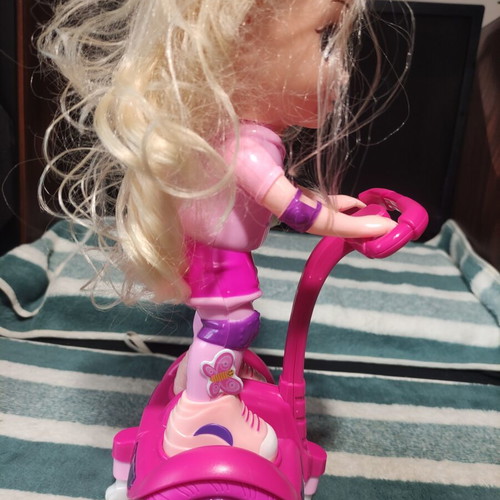 Doll with scooter, sound and lights, like new