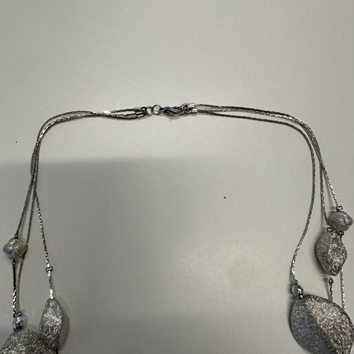 Triple necklace with silver pebble-like elements