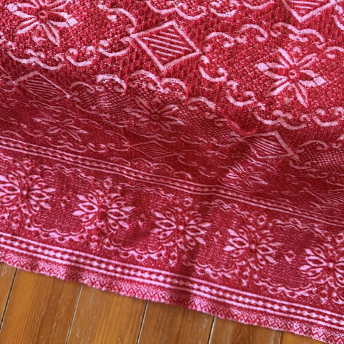 Vintage red wool blanket with geometric and floral patterns