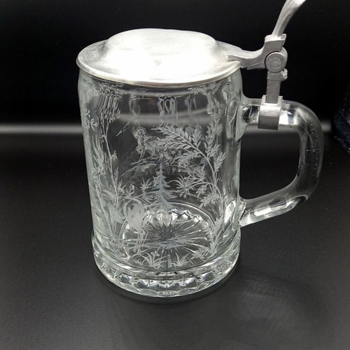 Glass beer mug with embossed hunting design like new from West Germany