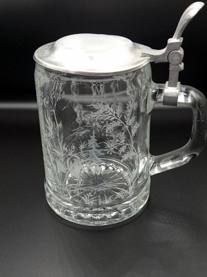 Glass beer mug with embossed hunting design like new from West Germany