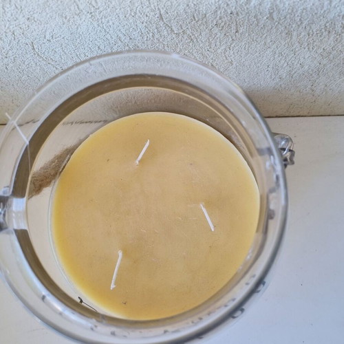 Aromatic candle in glass jar with quote