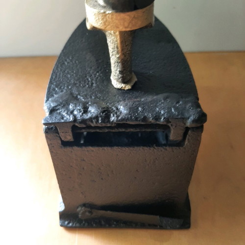 Charcoal iron used from 1920-30 with thorough restoration