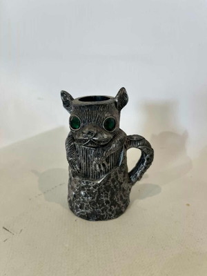 Vintage animal figure candle holder with green eyes, resin