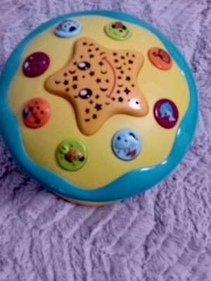 Baby toys used, set with lullaby player, ball, octopus, and pillow book