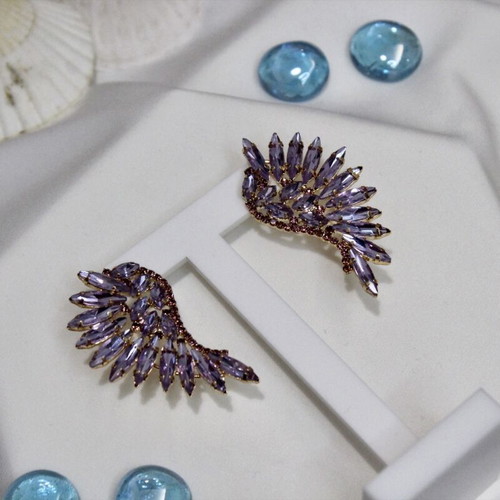 Earrings with purple stones angel wing design like new