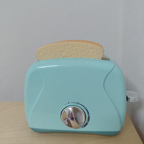 Toy Toaster like new with realistic functions and two fake bread slices