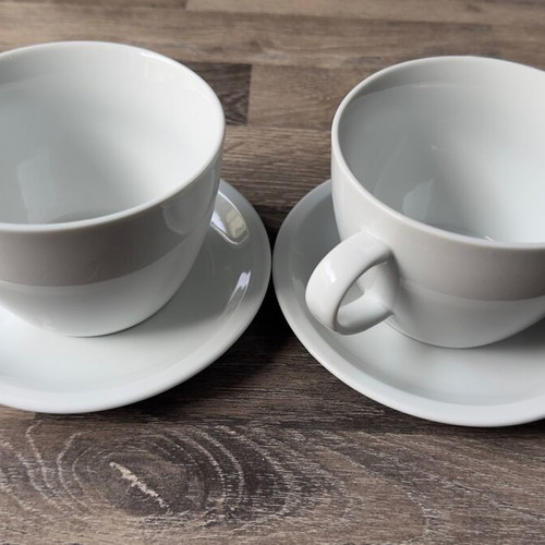 Set of 2 white coffee cups with saucers like new, minimal design