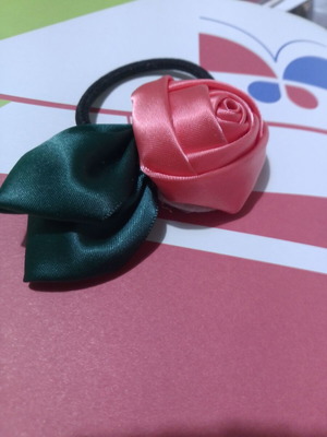 Hair accessory with fabric rose, coral and green