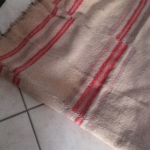 Kilim used light with fringes brown with red stripes