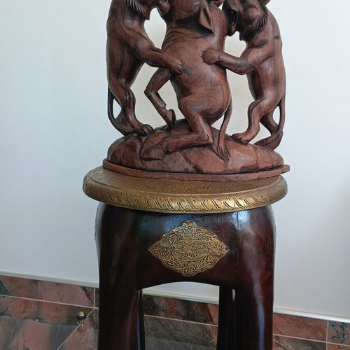 Hunting scene with buffalo and predators wood carving