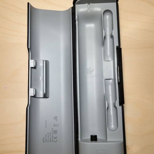 Oral-B Genius electric toothbrush with charging travel case used