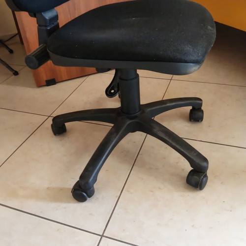 Office armchair with adjustable height and backrest