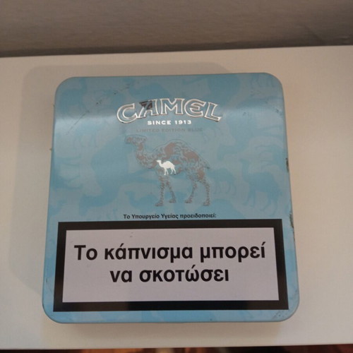 Camel and Winston collectible metal cigarette packs