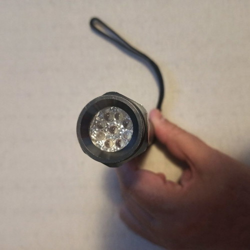 Led metal flashlight used
