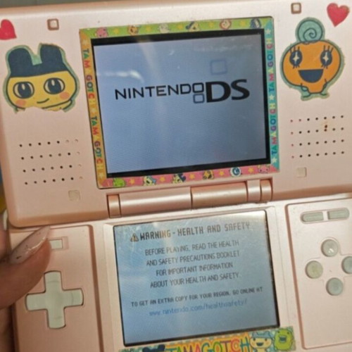 Nintendo DS used, pink with Tamagotchi stickers
