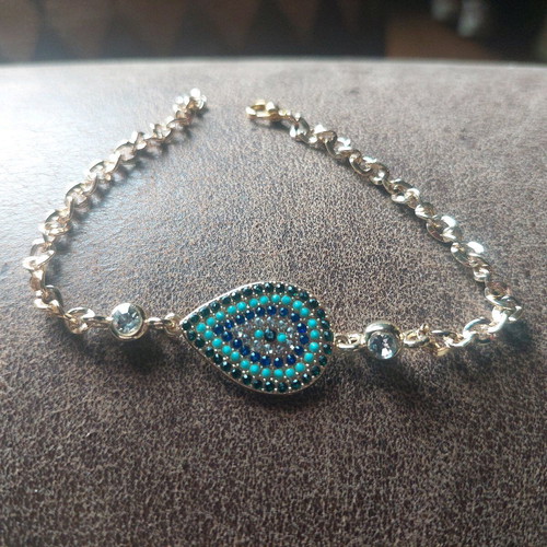 Gold bracelet new with eye and blue, turquoise, white stones