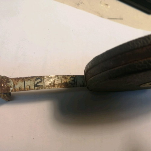 Measuring tape used, American, with inches or feet
