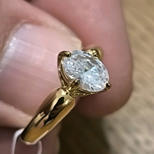 Gold ring with white crystal stone new, size 8